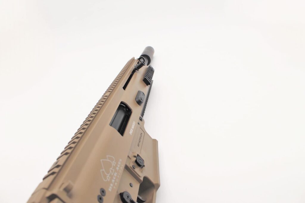 Photorealistic 8K lifestyle image of the SR12 in a hunting blind, camouflaged with FDE finish blending into desert terrain