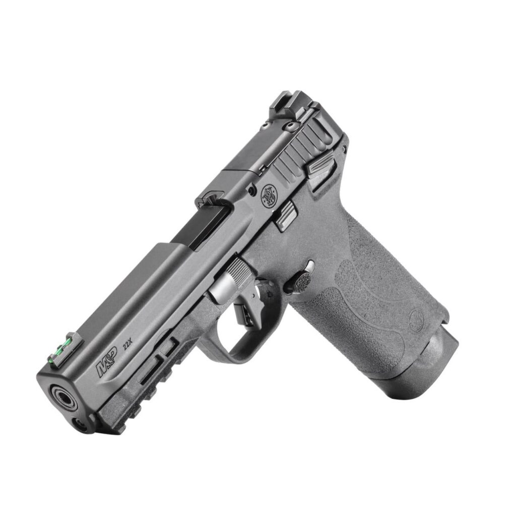 Scale photoreal 8K shot of the M&P 22X next to a standard ruler for size reference, black finish highlighted against neutral studio backdrop