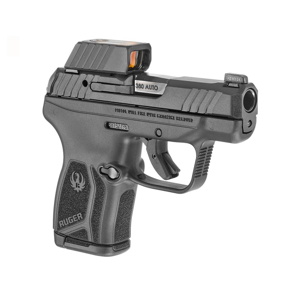 Photorealistic 8K lifestyle image of a Ruger LCP Max .380 Auto handgun in use at an indoor shooting range, held by a gloved hand aiming at a target, emphasizing compact size and reflex sight, natural lighting
