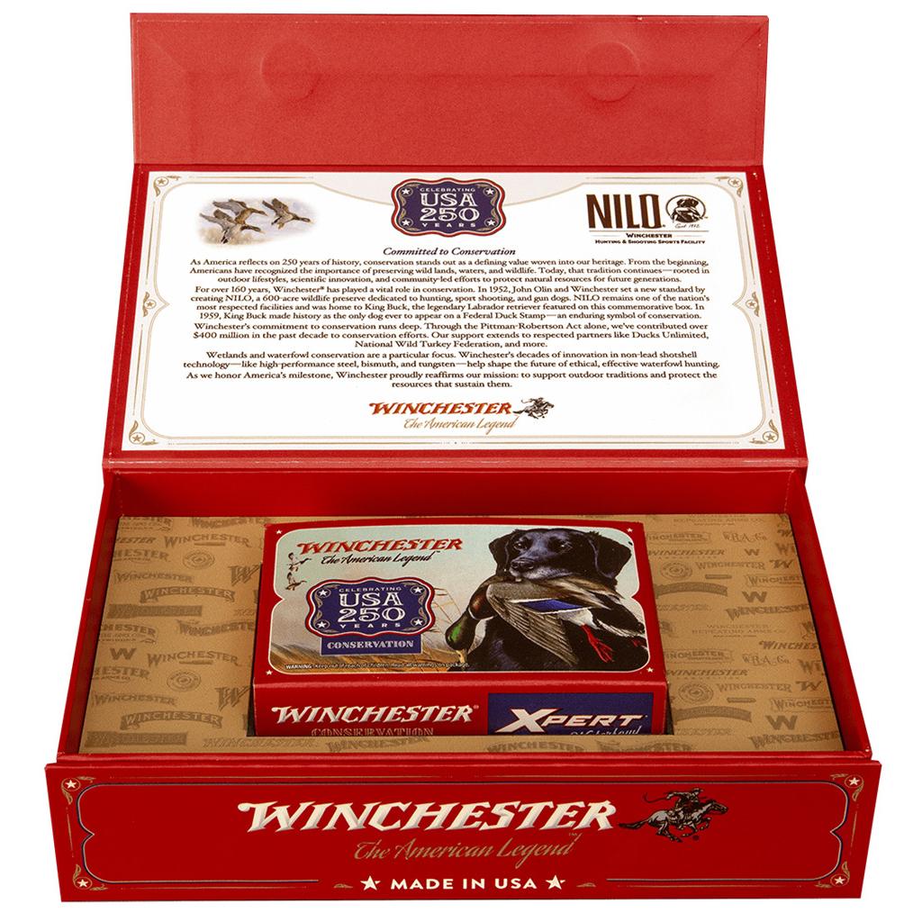 Photorealistic 8K macro detail shot of the Winchester Xpert Waterfowl shotshell box label showing 250th Anniversary branding, 12ga specs, and individual red hulls with #2 shot visible