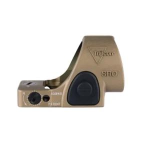 Lifestyle in-use shot of Trijicon SRO coyote brown red dot mounted on a competition pistol, held in shooter hands, soft studio lighting, 8K photoreal