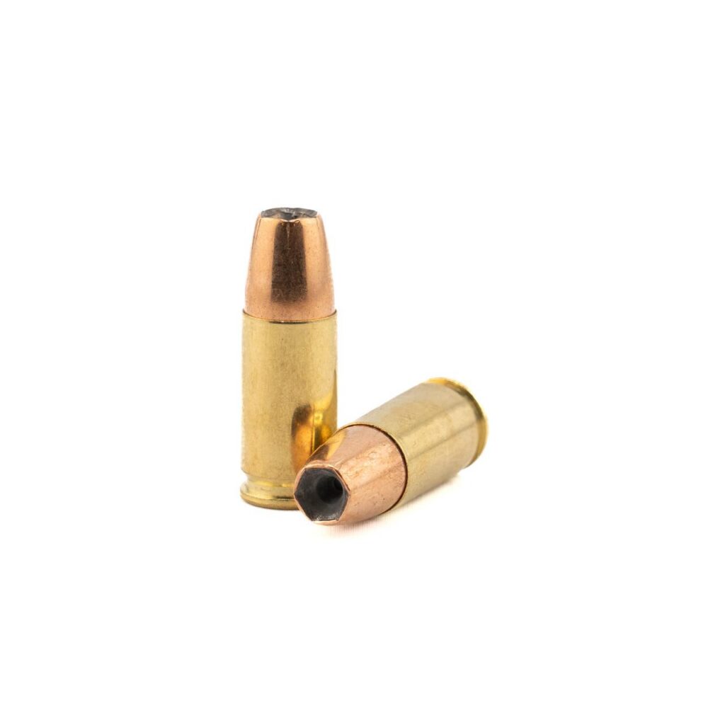 Photorealistic 8K lifestyle detail shot of Barnes Defense Sierra JHP 9mm ammunition box on dark premium surface with subtle reflections, emphasizing packaging texture and branding